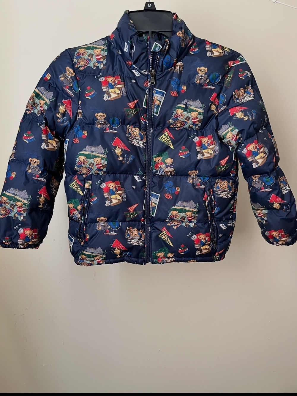Polo by Ralph Lauren Blue Puffer Jacket with space-themed design on a blue